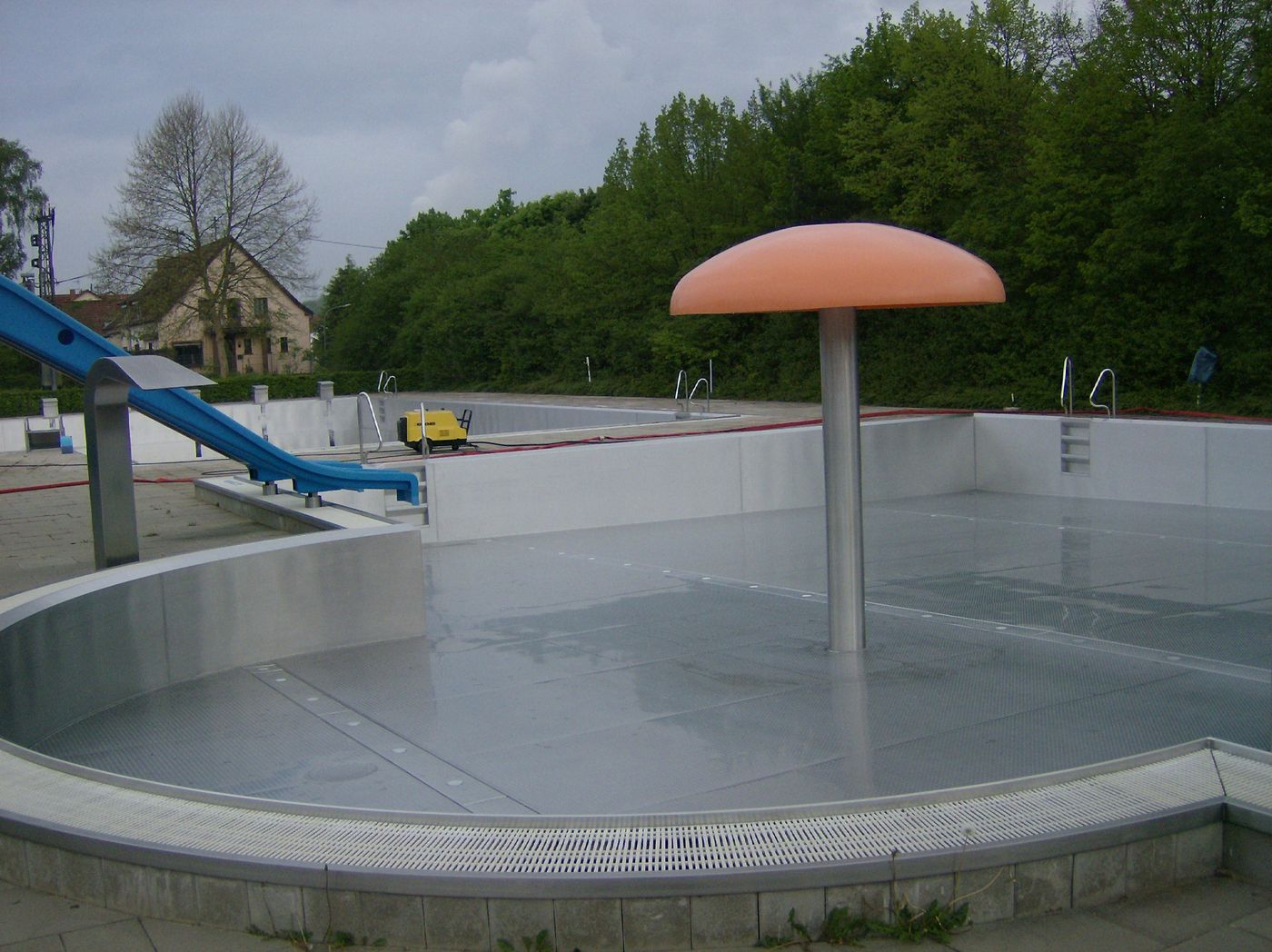 Outdoor pool with stainless-steel basin
