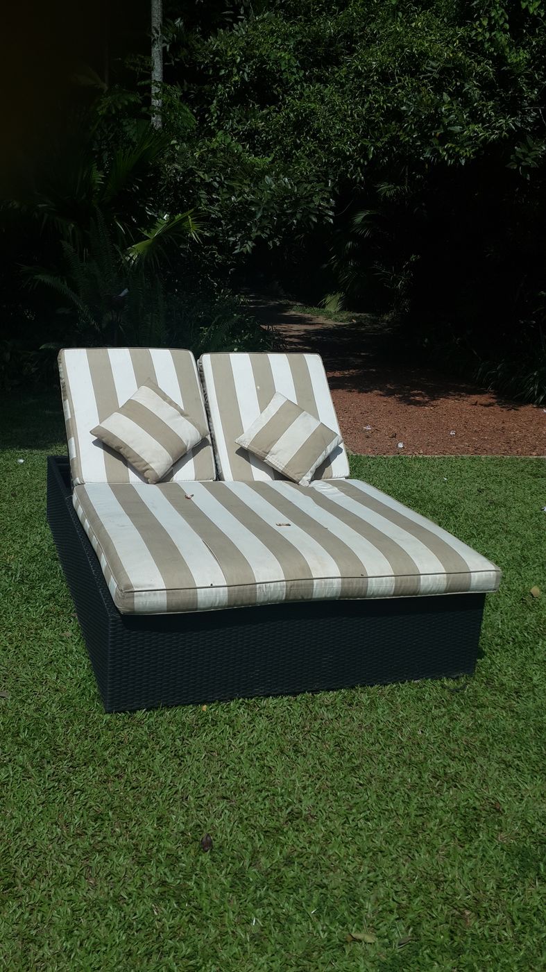 Sun lounger with treated upholstery